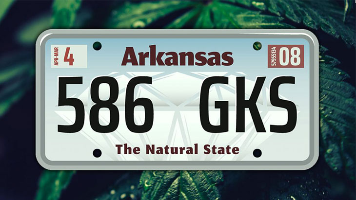 Arkansas license plate against a background of marijuana leaves